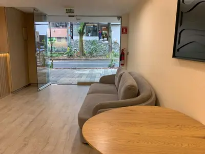a living room with a couch and a table at Hotel Poblado Boutique in Medellín