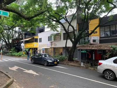 a car parked on the side of a city street at Hotel Poblado Boutique in Medellín