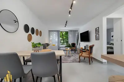a dining room and living room with a table and chairs at Ankara 301 - Contemporary Loft Trendy in provenza in El Poblado