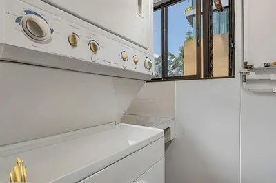 a kitchen with white appliances and a window at Ankara 401 - Modern and comfort Apt in Provenza in El Poblado