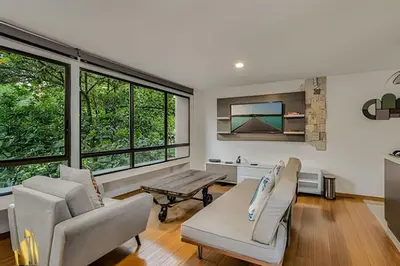 a living room with two chairs and a table at Ankara 402 - Private bright apt/ Provenza in El Poblado