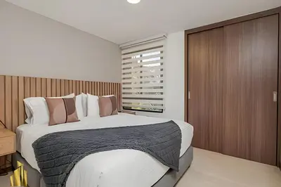 a bedroom with a large bed and a window at Ankara 501 - Modern Apt inside Provenza with AC in El Poblado