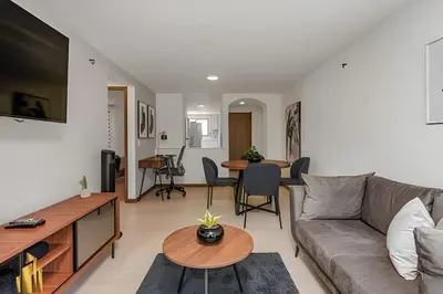 a living room with a couch and a table at Ankara 501 - Modern Apt inside Provenza with AC in El Poblado