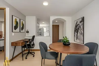 a dining room with a table and chairs at Ankara 501 - Modern Apt inside Provenza with AC in El Poblado
