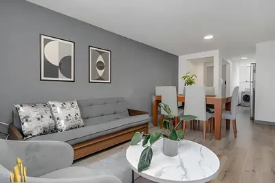 a living room with a couch and a table at Ankara 602 - Private clean & bright Apt with AC in El Poblado