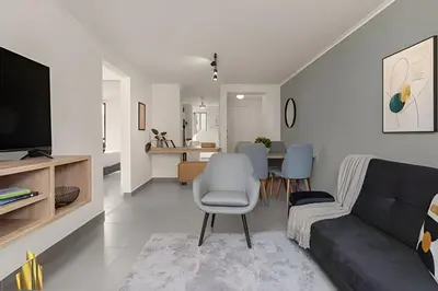 a living room with a couch and a dining room at Ankara 701 - Contemporary clean loft/ Provenza in El Poblado