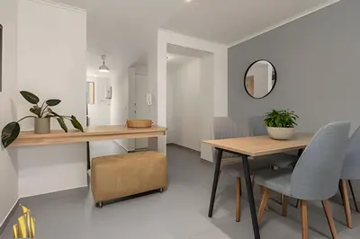 a dining room with a table and a mirror at Ankara 701 - Contemporary clean loft/ Provenza in El Poblado