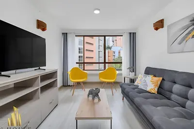 a living room with a couch and a tv at Ankara 702 - Sophisticated & clean apt in Provenza in El Poblado