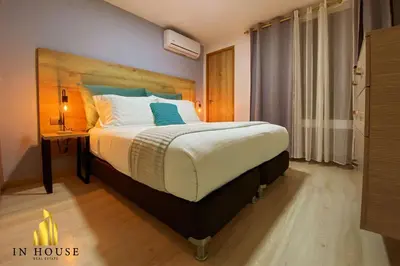a bedroom with a large bed with a nightstand and a bed sidx sidx sidx at Ankara 702 - Sophisticated & clean apt in Provenza in El Poblado
