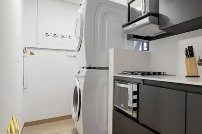 a white kitchen with a refrigerator and a stove at Ankara 802 - Secure & Private apt/ Trendy Provenza in El Poblado