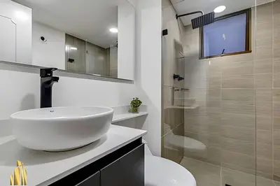 a white bathroom with a sink and a shower at Ankara 802 - Secure & Private apt/ Trendy Provenza in El Poblado