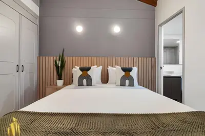 a bedroom with a large white bed with pillows at Ankara 802 - Secure & Private apt/ Trendy Provenza in El Poblado