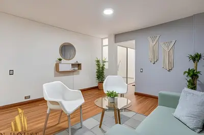 a living room with a couch and chairs at Aria Living 200 - Vibrant Apartment in Laureles in Guayaquil