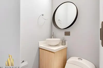 a bathroom with a sink and a mirror at Aria Living 201 - Where Design and Location Shine in Guayaquil