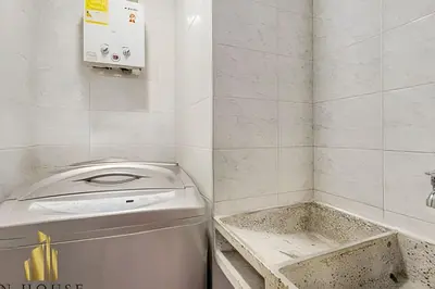 a small bathroom with a washing machine in it at Aria Living 201 - Where Design and Location Shine in Guayaquil