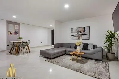 a living room with a couch and a table at Aria Living 202 - Spacious Urban Luxury Retreat in Guayaquil