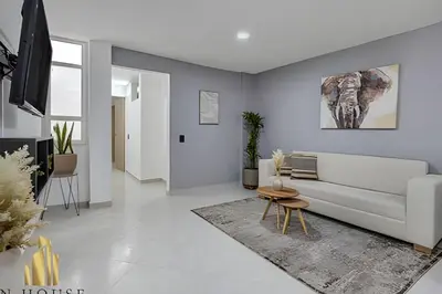 a living room with a couch and a table at Aria Living 300 - Style and Urban Comfort in Guayaquil