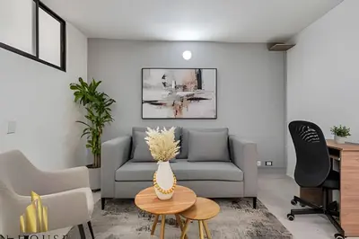 a living room with a couch and a table at Aria Living 301 - Total Exclusivity in Laureles in Guayaquil