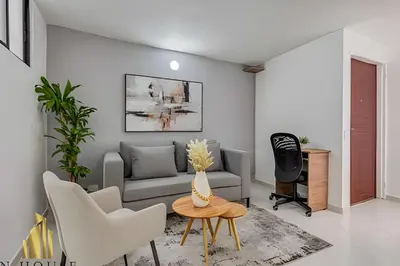 a living room with a couch and a table at Aria Living 301 - Total Exclusivity in Laureles in Guayaquil