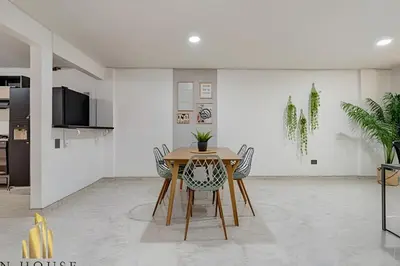 a dining room with a table and chairs at Aria Living 302 - Modern and central in Laureles in Guayaquil