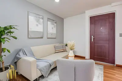 a living room with a couch and a door at Aria Living 401 - Sophisticated Living in Laureles in Guayaquil