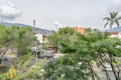 a view of a parking lot with a school bus at Aria Living 401 - Sophisticated Living in Laureles in Guayaquil