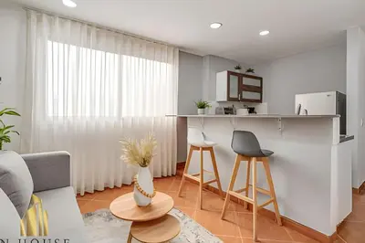 a living room with a couch and a table at Aria Living 500 - Modern with Private Terrace in Guayaquil