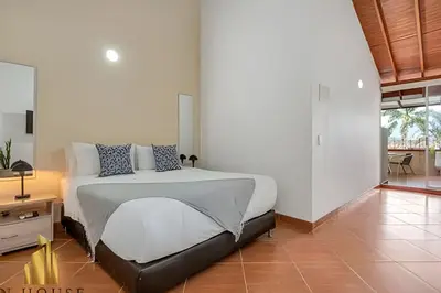 a bedroom with a large bed in a room at Aria Living 500 - Modern with Private Terrace in Guayaquil