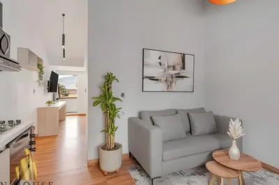 a living room with a couch and a table at Aria Living 501 - Design and Perfect Location in Guayaquil