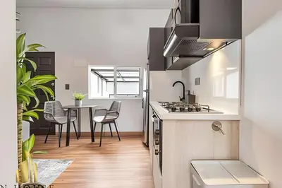 a kitchen and dining room with a table and chairs at Aria Living 501 - Design and Perfect Location in Guayaquil