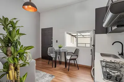 a kitchen and dining room with a table and chairs at Aria Living 501 - Design and Perfect Location in Guayaquil