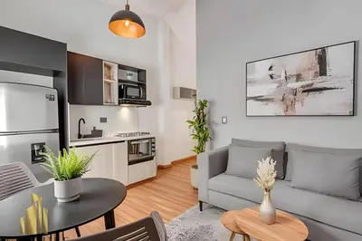 a living room with a couch and a table at Aria Living 501 - Design and Perfect Location in Guayaquil