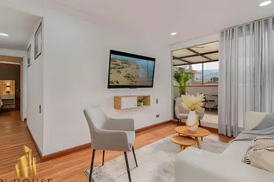 a living room with a couch and a table at Aria Living 502 - Luxury Terrace in Laureles in Guayaquil