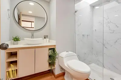 a bathroom with a sink and a mirror at Aria Living 502 - Luxury Terrace in Laureles in Guayaquil