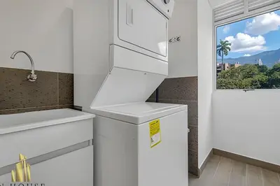 a kitchen with white appliances and a window at Campestre 704 - Sophisticated Apt with AC & gym in Envigado