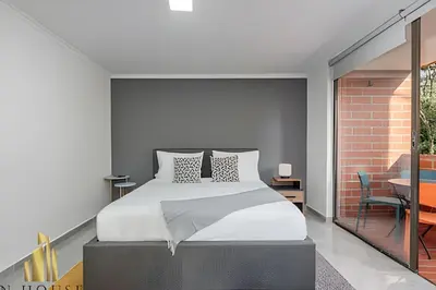 a bedroom with a king sized bed in a room at Caracolí 301 - Donde el Estilo Grita Libertad in El Poblado