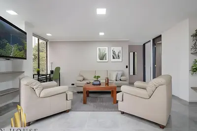 a living room with two chairs and a table at Caracolí 301 - Donde el Estilo Grita Libertad in El Poblado