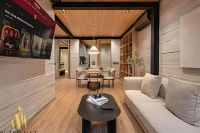 a living room with a white couch and a table at Casa Biflora - Natural luxury in top location in El Poblado
