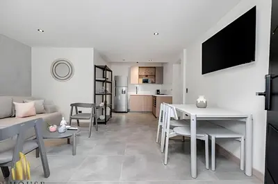 a living room with a couch and a table at Casa Solei 12-13 - Prestigious & Priv Apt/Bath Tub in El Poblado