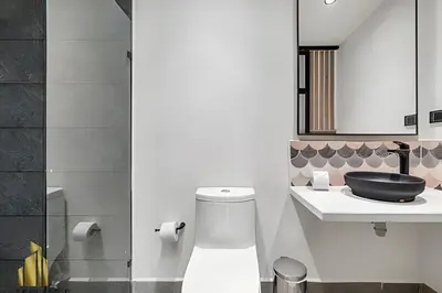 a bathroom with a toilet and a sink at Casa Solei 12-13 - Prestigious & Priv Apt/Bath Tub in El Poblado