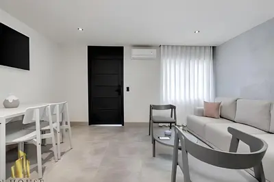 a living room with a couch and a table at Casa Solei 12-13 - Prestigious & Priv Apt/Bath Tub in El Poblado