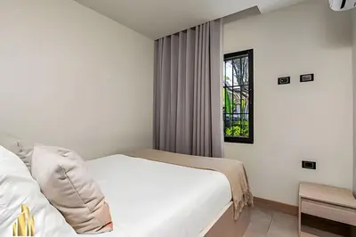 a bedroom with a white bed and a window at Casa Solei 12-3 - Prime Location: Enjoy El Poblado in El Poblado