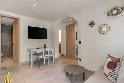 a living room with a table and a couch at Casa Solei 12-3 - Prime Location: Enjoy El Poblado in El Poblado