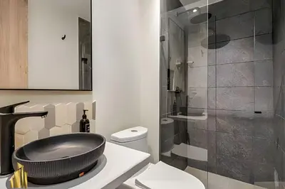 a bathroom with a sink and a toilet and a shower at Casa Solei 12-3 - Prime Location: Enjoy El Poblado in El Poblado