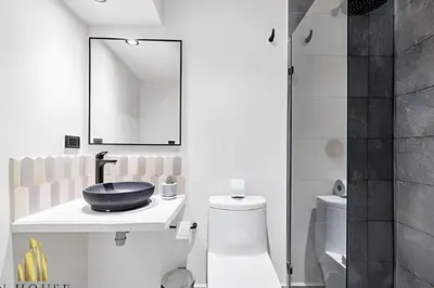 a bathroom with a sink and a toilet and a mirror at Casa Solei 12-3 - Prime Location: Enjoy El Poblado in El Poblado