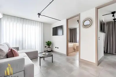 a living room with a couch and a table at Casa Solei 12-7 - Bright & Chic Apt in Manila / AC in El Poblado