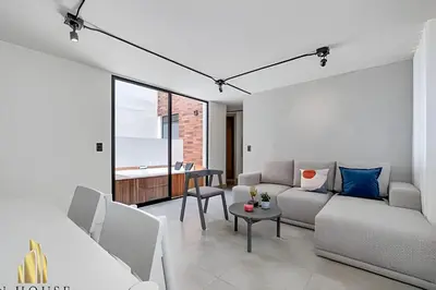 a living room with a couch and a table at Casa Solei 12-9 - Stylish Apt with Jacuzzi & AC in El Poblado