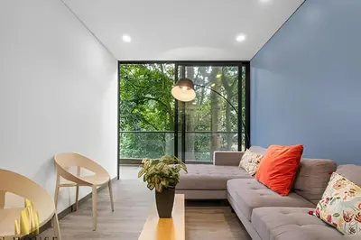 a living room with a couch and a table at Class Suites 202 - Colorful with Pool and gym in El Poblado