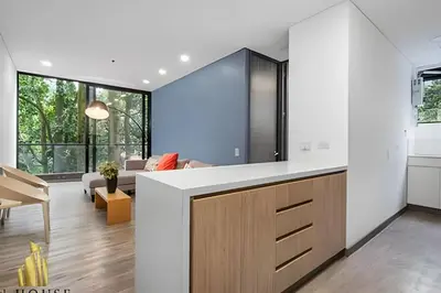 a kitchen and living room with a large counter top at Class Suites 202 - Colorful with Pool and gym in El Poblado
