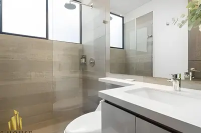 a white bathroom with a sink and a mirror at Class Suites 202 - Colorful with Pool and gym in El Poblado